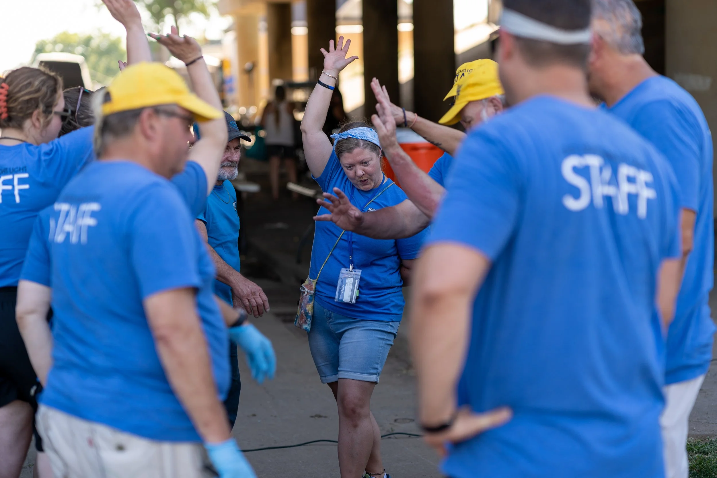 Volunteers serving together under the bridge