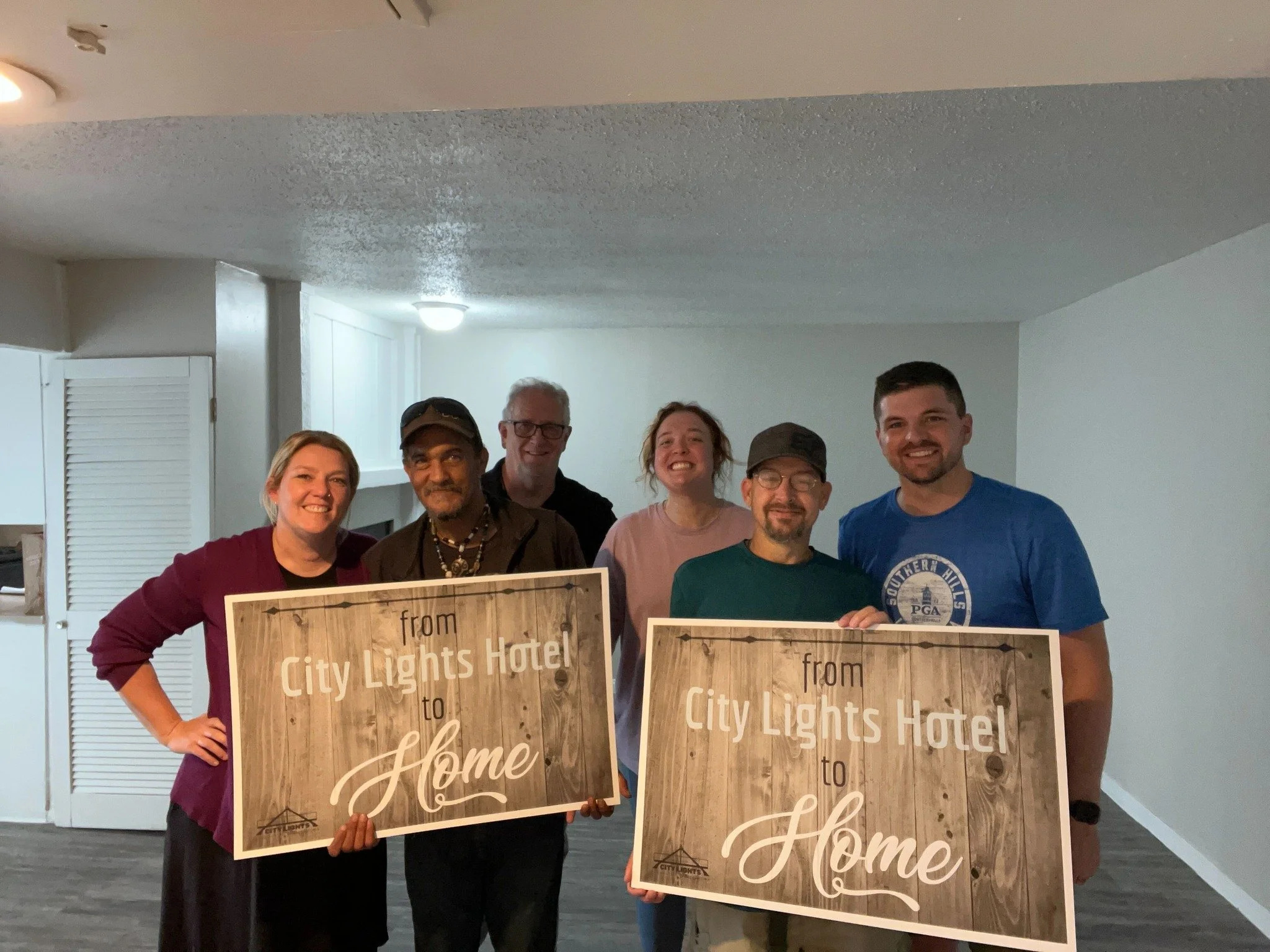 Neighbors celebrating housing stability